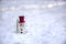 Christmas Themed vintage wooden toy Snowman in snow. Close up view of snowman in winter snow background