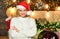 Christmas time. happy new year. christmas preparation. girl in red santa claus hat. Cheerful woman. In sweater. winter