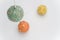 Christmas time papier mache decoration balls on a white background