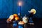Christmas time, winter, mulled wine in glass, cinnamon, orange and mandarin, cookies and chocolate, a candle in a candlestick