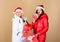 Christmas together. winter holidays. family vacation. women in down jacket. girls santa claus hat. christmas fashion