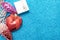 Christmas toy bump, christmas heart shaped red ball and small gift box on background