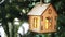 Christmas toy house in bright green moss and fir branches