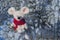 Christmas toy mouse, a symbol of the Chinese New Year. Sits on snowy branches. The concept of winter, warmth and comfort