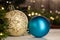 Christmas toy white ball next to a blue bal