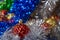 Christmas toys golden and red color in tinsel, blue, silver and green colors