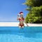 Christmas travel beach holidays in Maldives. Christmas Maldives beach and Santa Claus woman. Bikini girl wearing santa hat