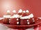 Christmas treats party food Strawberry Santas on red and white theme table.