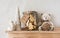 Christmas treats for Santa - cookies in a jar, Christmas decorations on a wooden shelf-hanger on the wall in a bright room