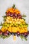 Christmas tree of appetizers: cheese, grapes and crackers, top v