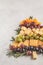 Christmas tree of appetizers: cheese, grapes and crackers, top v
