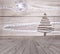 Christmas tree arranged from sticks on empty wooden deck table on sparkly grey background. Ready for product display montage