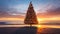 Christmas tree on the beach at sunset