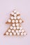 Christmas tree biscuits. White tablets. Light background