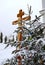 Christmas tree branch with decorations on the background of the Orthodox cross with a crucifix. The Orthodox Church. Winter is Chr