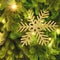 Christmas tree branch with snowflake, close-up. New Year snow ornament for festive