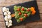 Christmas tree of broccoli, cauliflower, tomato, pepper closeup