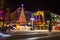 Christmas tree and buildings at night in National Harbor, Maryland.