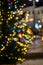 Christmas tree with burning garland, blurred photo