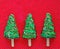 Christmas tree cakes, festive pie pieces decorated with green frosting and sprinkles