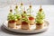 Christmas tree canape with cucumber slice, salmon pate and red caviar