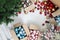 Christmas tree and cardboard boxes full of christmas balls and decorations, isolated on white floor, preparation concept, top view