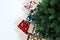 Christmas tree and cardboard boxes full of Christmas balls, top view, isolated on white floor, preparation concept