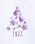 Christmas tree from christmas shine toys with sequins, minimal New Year composition lavender color, text number 2022