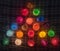 Christmas tree, colorful garland  on the caged background