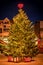 Christmas tree covered with snow in Hafnarfjordur, Iceland.