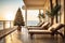 A Christmas tree is decorated on the balcony of a hotel with sun beds by the sea on vacation in a tropical country with palm trees