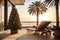 A Christmas tree is decorated on the balcony of a hotel with sun beds by the sea on vacation in a tropical country with palm trees