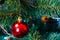 Christmas tree decoration. Balls, stars garland on a tree. Red bows on a New Year tree. The festive tree is decorated with bright