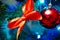 Christmas tree decoration. Balls, stars garland on a tree. Red bows on a New Year tree. The festive tree is decorated with bright