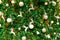 Christmas tree decoration with red, gold, silver, and white balls, silver star and white reindeer. Xmas background. Christmas