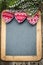 Christmas tree decorations border on vintage wooden blackboard