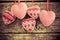 Christmas tree decorations hanging against grunge wooden background