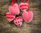 Christmas tree decorations hanging against grunge wooden background