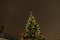 Christmas tree with decorations and lights, european Christmas market