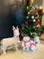 Christmas tree with deer, bear and penguin in living room
