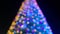 Christmas tree defocused background, tilt up frame