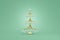 Christmas tree fragile gold wire decoration hanging ball crystal glass. Graceful toy concept design green background. Elegant