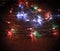 Christmas tree garland laid out on a wooden table