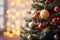 Christmas tree with golden decorations and bokeh lights on dark background