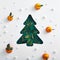 Christmas tree with green leaf, snow and tangerine