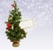 Christmas tree with greeting postcard