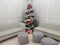 Christmas tree with grey chairs and seats