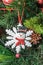 Christmas tree hanging ornament, snowflake and snowman, close up