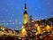 Christmas  tree holiday in Tallinn old town square night city blurring light and snowflakes fall