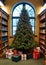 A Christmas Tree In A Library, With Books As Gifts Underneath. Generative AI